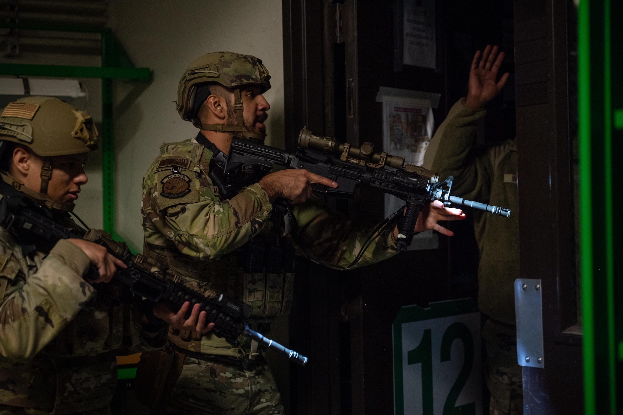 U.S. Airmen assigned to the 7th Security Forces Squadron perform building clearing procedures during an active shooter exercise at Dyess Air Force Base, Texas, Dec. 3, 2025. The exercise allowed Defenders to refine close-quarters battle tactics and security procedures for real-world incidents. (U.S. Air Force photo by Airman 1st Class Adrien Tran)