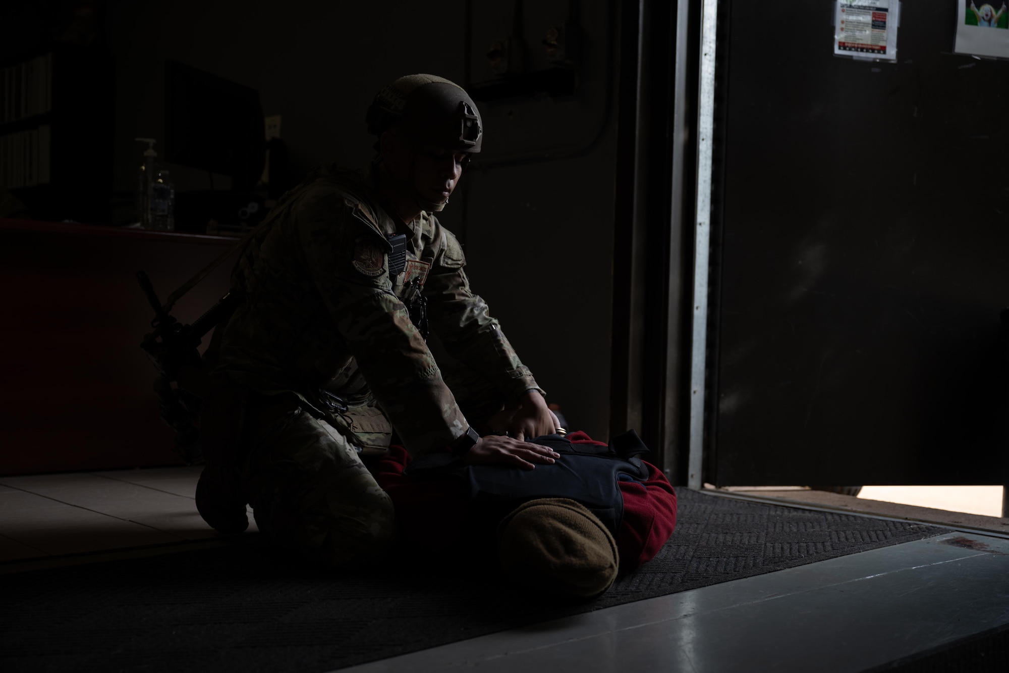 U.S. Air Force Senior Airman Hector Cavazos, 7th Security Forces Squadron junior patrolman, detains a suspect during an active shooter exercise at Dyess Air Force Base, Texas, Dec. 3, 2025. Members of the 7th SFS   protect operational resources as well as provide security for the entire installation in a law enforcement capacity. (U.S. Air Force photo by Airman 1st Class Adrien Tran)