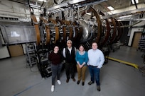(Left)Emily Lichko, PhD, U.S. Naval Research Laboratory (NRL) Karles Fellowship, Gurudas Ganguli, PhD, NRL senior scientist, Ami M. DuBois, PhD, NRL research physicist), Chris Crabtree, PhD, NRL section head, stand in front of NRL’s Space Physics Simulation Chamber in Washington, D.C., Nov. 12, 2025. Lichko, Ganguli, DuBois and Crabtree worked together studying the electric field link that triggers magnetic reconnection in space that could help with predicting disruptive space weather events when they are about to occur. (U.S. Navy photo by Jonathan Steffen-Arnold)