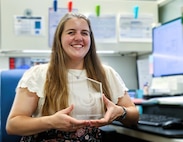 Naval Surface Warfare Center, Philadelphia Division Engineer Amanda DiAlessandro shows her award after finishing the Fiscal Year 2025 NAVSEA NextGen Leadership Development Program, marking an important milestone in her career.