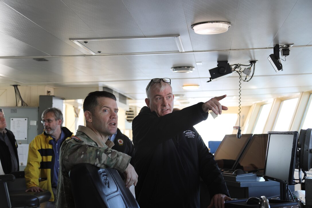 Dredge McFarland Master Mike Hass discusses dredging operations with Col. Jesse T. Curry on the bridge of the Dredge McFarland during a Dec. 3, 2025, visit. The Dredge McFarland has been a critical asset to maintaining navigation across the nation for more than five decades.