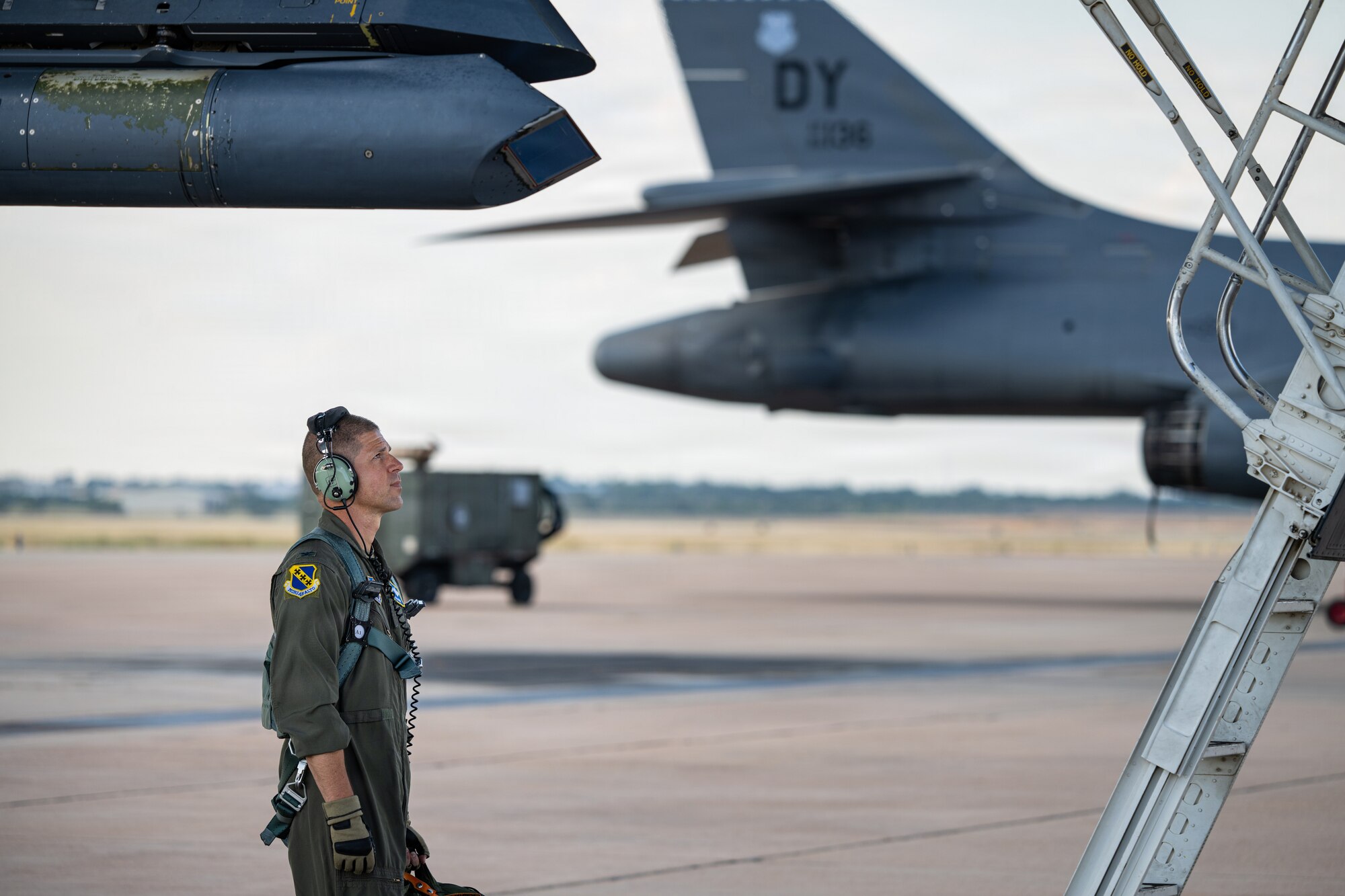 U.S. Air Force Col. Seth Spanier, 7th Bomb Wing commander and B-1B Lancer pilot, prepares to board a B-1B for a routine training flight at Dyess Air Force Base, Texas, Sept. 15, 2025. Routine training flights enable crews to maintain a high state of readiness and proficiency and validate the always-ready global strike capability. (U.S. Air Force photo by Senior Airman Jade M. Caldwell)
