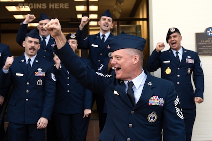 U.S. Air Force Chief Master Sgt. William Rawls, Air Force Recruiting Service chief recruiter, chants with recruiters and guests during the Operation Blue Suit Arrival Ceremony at Joint Base San Antonio-Randolph, Texas,