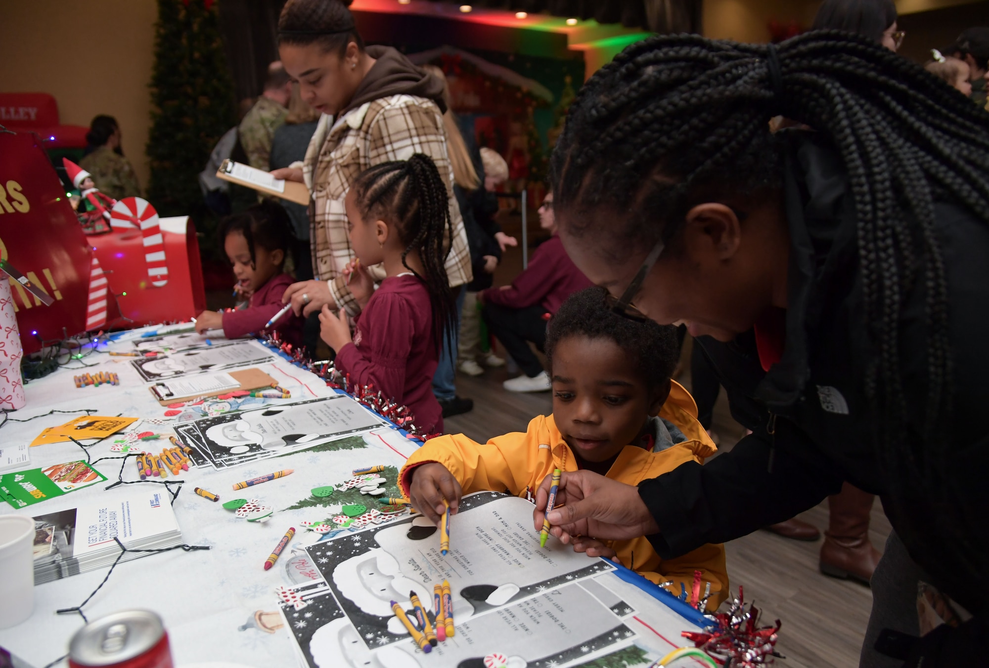 A group of people write on paper