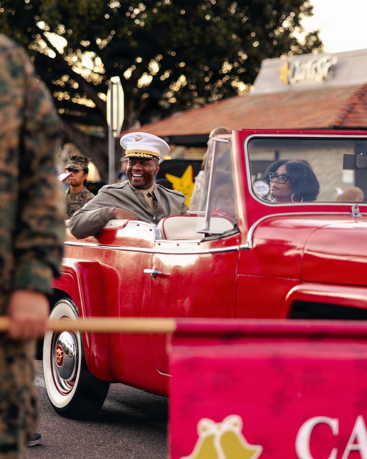 U.S. Marine Corps Brig. Gen. Brown, center, the commanding general of Marine Corps Installations West, Marine Corps Base Camp Pendleton, attends the 44th Annual Fallbrook Christmas Parade in Fallbrook, California, on Dec. 6, 2025. Once a year, the city hosts a parade to celebrate Christmas and spread holiday cheer throughout the community. (U.S Marine Corps photo by Sgt. Rafael).