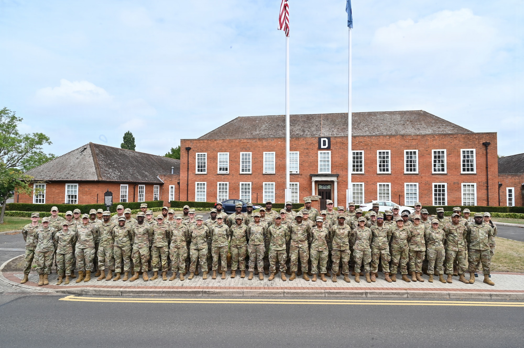 Maryland Air National Guard 175th Force Support Squadron members pose for a group photo during their annual training at RAF Mildenhall, England, July 23, 2025. The training consisted of seventy-five members of the Maryland Air National Guard’s 175th Force Support Squadron and administrative staff from units across the 175th Wing where they strengthened deployment readiness through hands-on exercises, team building, and mission-focused learning. (U.S. Air National Guard Photo by Staff Sgt. Alexandra Huettner)