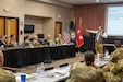Dr. Sami Sweis, assistant professor of international studies at Centre College, speaks to Kentucky National Guard senior leaders during a conference at Kentucky State University in Frankfort, Kentucky, Dec. 1, 2025.  Sweis briefed the military leaders on relevant topics such as ethical operational implications of the use of AI, and long-term studies on the conflict in Russia and Ukraine.  (U.S. Army National Guard photo by Maj. Cody Stagner)