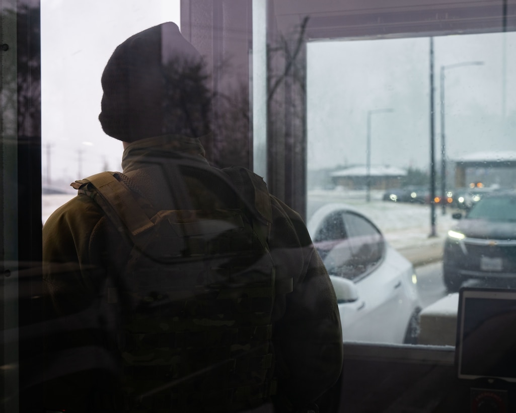 Person stands in booth