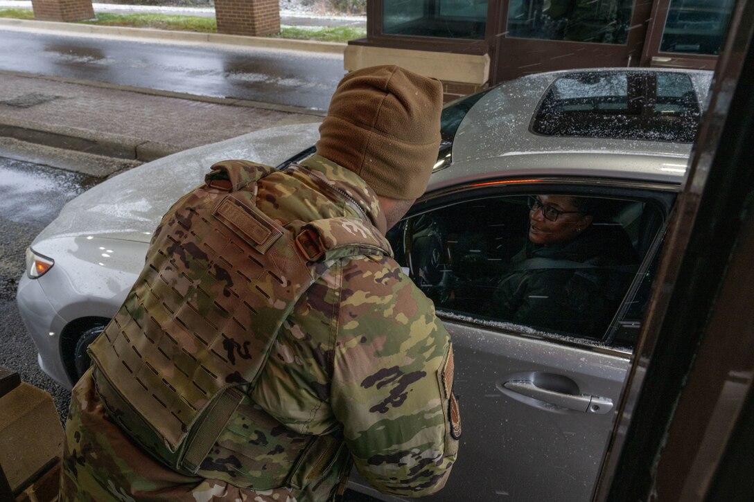 Person speaks to someone in car