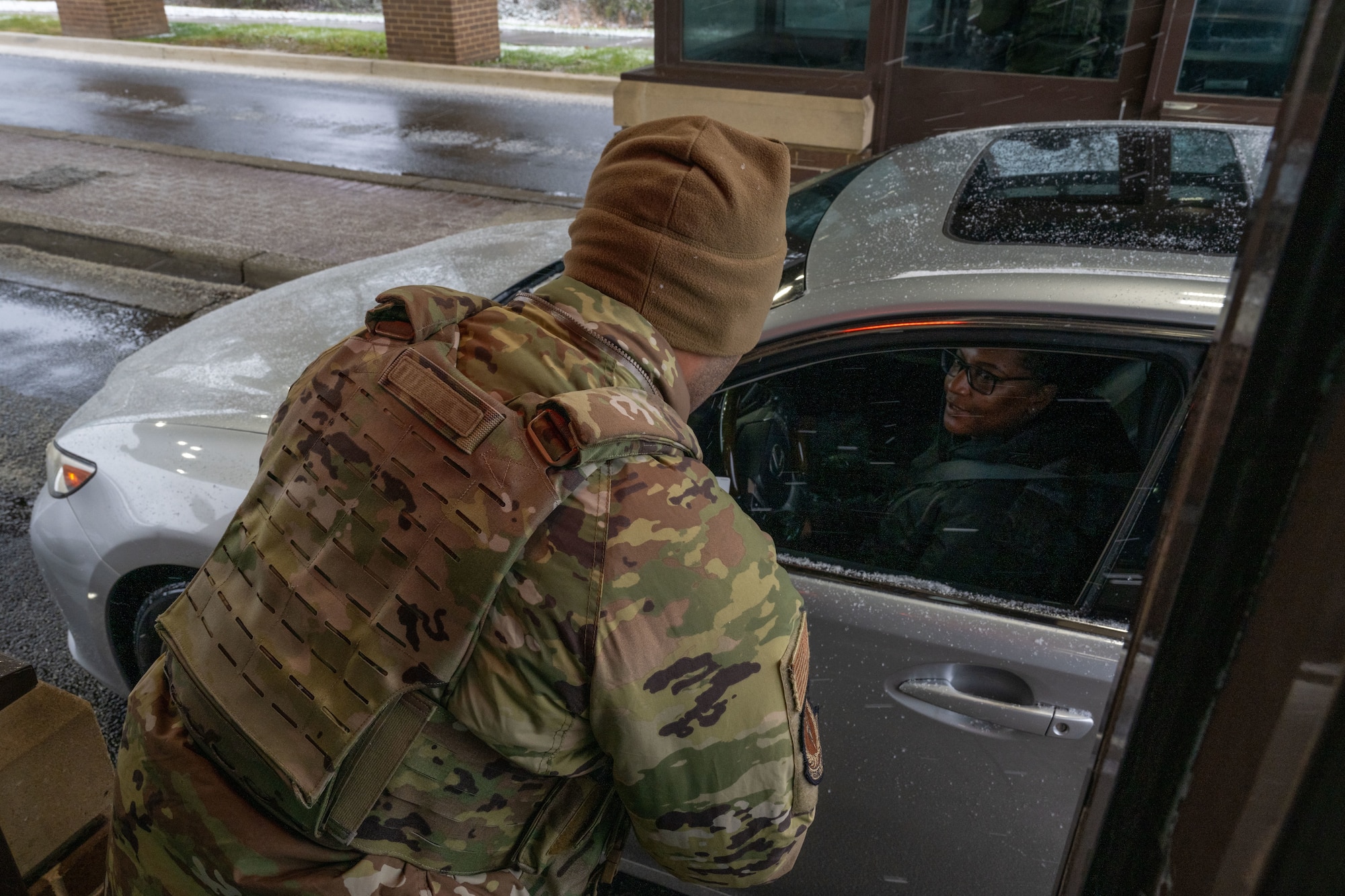 Person speaks to someone in car