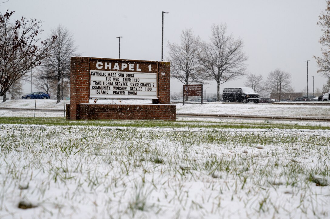 Sign with snow on it