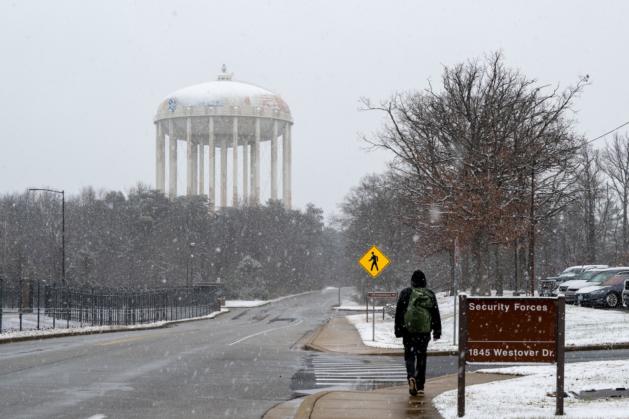 A person walks on sidewalk