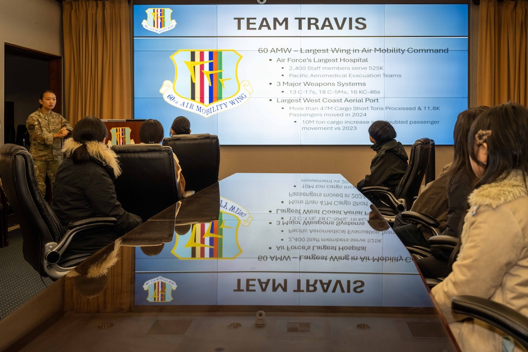 Students listen to a briefing about Travis Air Force base