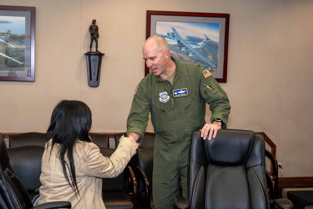 Student from Japan shakes hands with Air Force Colonel