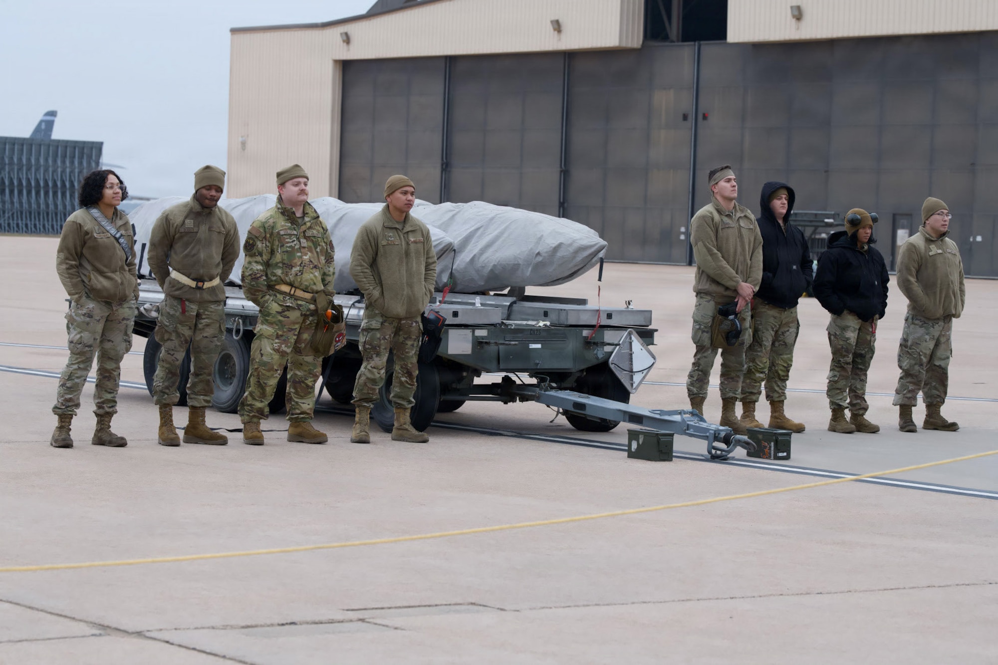 U.S. Airmen assigned to the 9th and 28th Bomber Generation Squadrons prepare to load weapons during the annual Weapons Load Crew of the Year competition at Dyess Air Force Base, Texas, Dec. 4, 2025. During the annual competition, teams competed for the title of 7th Bomb Wing’s best load crew. (U.S. Air Force photo by Senior Airman Emma Anderson)