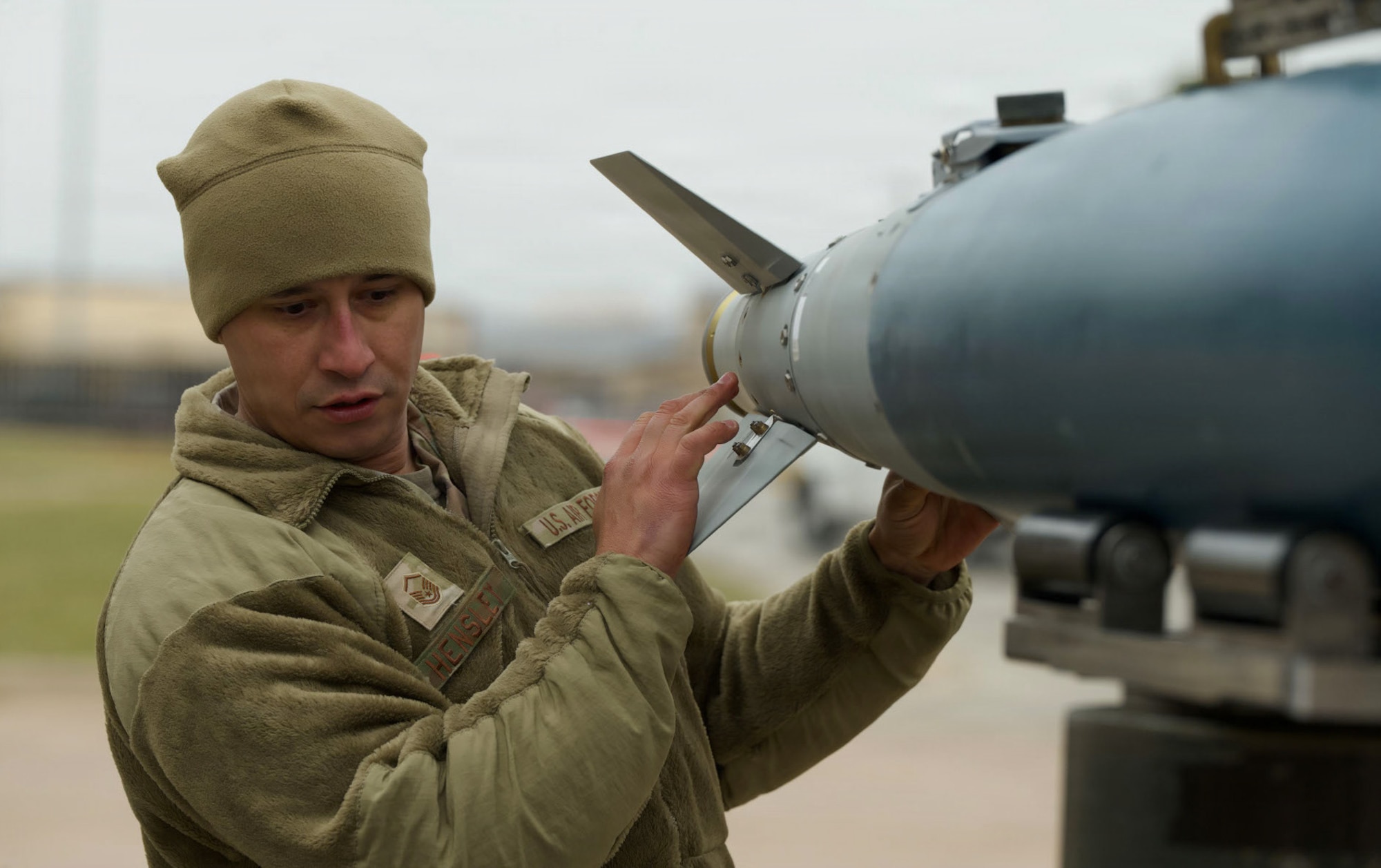 U.S. Air Force Master Sgt. Michael Hensley, B-21 Raider Program Integration Office armament systems manager, inspects a guided bomb unit during the annual Weapons Load Crew of the Year competition at Dyess Air Force Base, Texas, Dec. 4, 2025. Load crew competitions assess teams on their expertise, technical precision and ability to work together under pressure. (U.S. Air Force photo by Senior Airman Emma Anderson)
