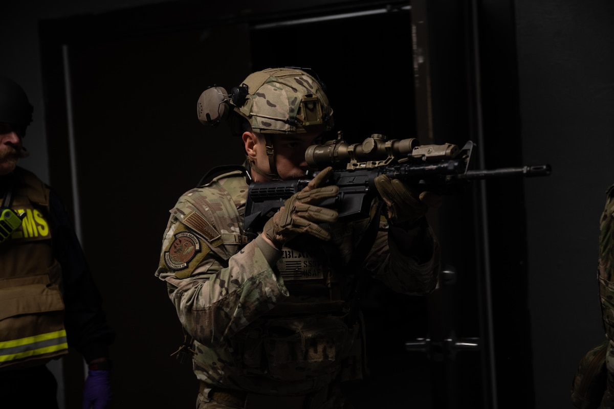 U.S. Air Force Staff Sgt. Zachary LeBlanc, 7th Security Forces physical security noncommissioned officer in charge, conducts building clearing procedures during an active shooter exercise at Dyess Air Force Base, Texas, Dec. 3, 2025. The exercise tested the 7th SFS’s speed, coordination and decision-making, to strengthen installation defense. (U.S. Air Force photo by Airman 1st Class Adrien Tran)