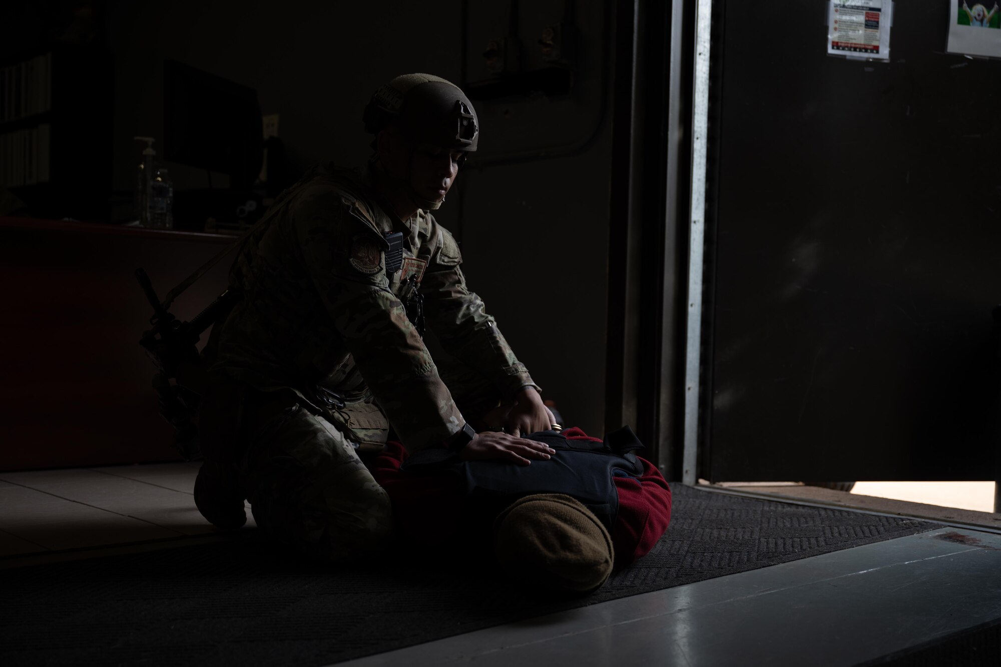U.S. Air Force Senior Airman Hector Cavazos, 7th Security Forces Squadron junior patrolman, detains a suspect during an active shooter exercise at Dyess Air Force Base, Texas, Dec. 3, 2025. Members of the 7th SFS   protect operational resources as well as provide security for the entire installation in a law enforcement capacity. (U.S. Air Force photo by Airman 1st Class Adrien Tran)