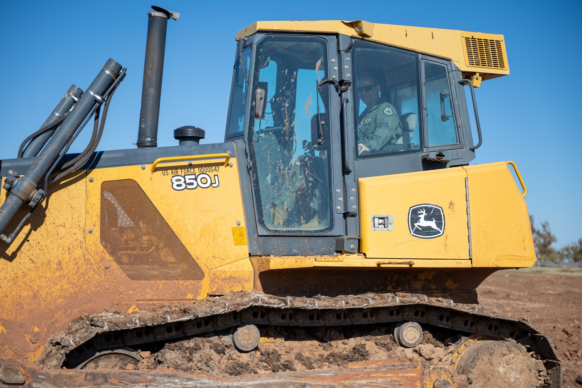 Col. Richard Kind, 97th Air Mobility Wing commander, operates a bulldozer from the 97th Civil Engineer Squadron at Altus Air Force Base, Oklahoma, Nov. 4, 2025. Kind was visiting the site of a future detention pond, gaining a first-hand view of the work being accomplished. (U.S. Air Force photo by Airman 1st Class Nathan Langston)