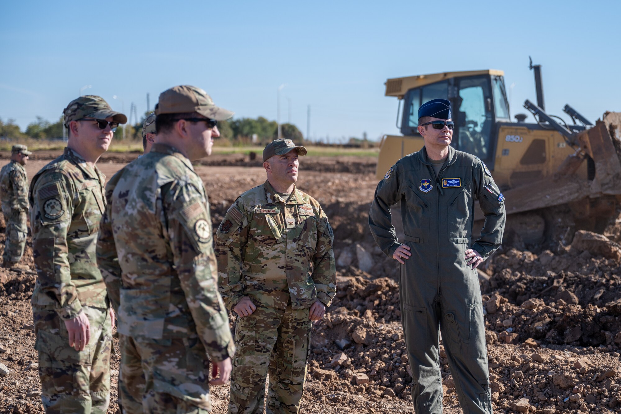 The 97th Air Mobility Wing command team stands with 97th Civil Engineer Squadron leadership at the site of a future detention pond at Altus Air Force Base, Oklahoma, Nov. 4, 2025. The visit was a part of the command team’s first hands-on immersion tour of facilities around the base. (U.S. Air Force photo by Airman 1st Class Nathan Langston)