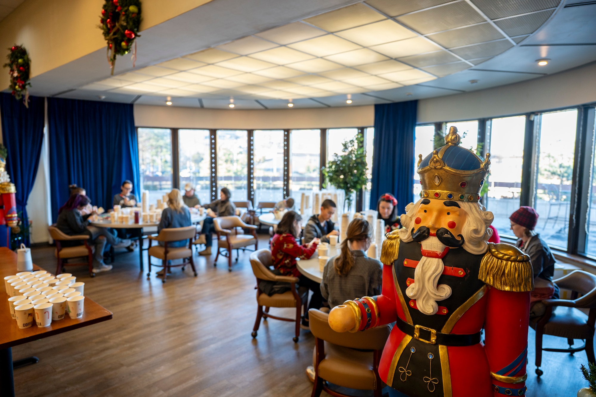 Volunteers assemble holiday care packages for unaccompanied Airmen in dorms at Osan Air Base, Republic of Korea, Dec. 8, 2025.
