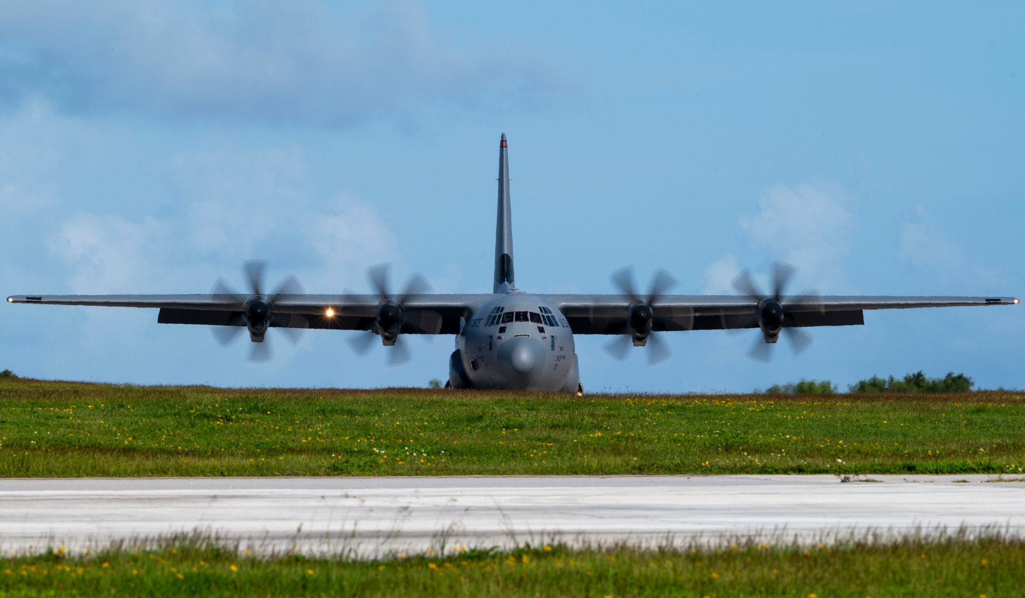 A C-130 aircraft taxis along the flightline.