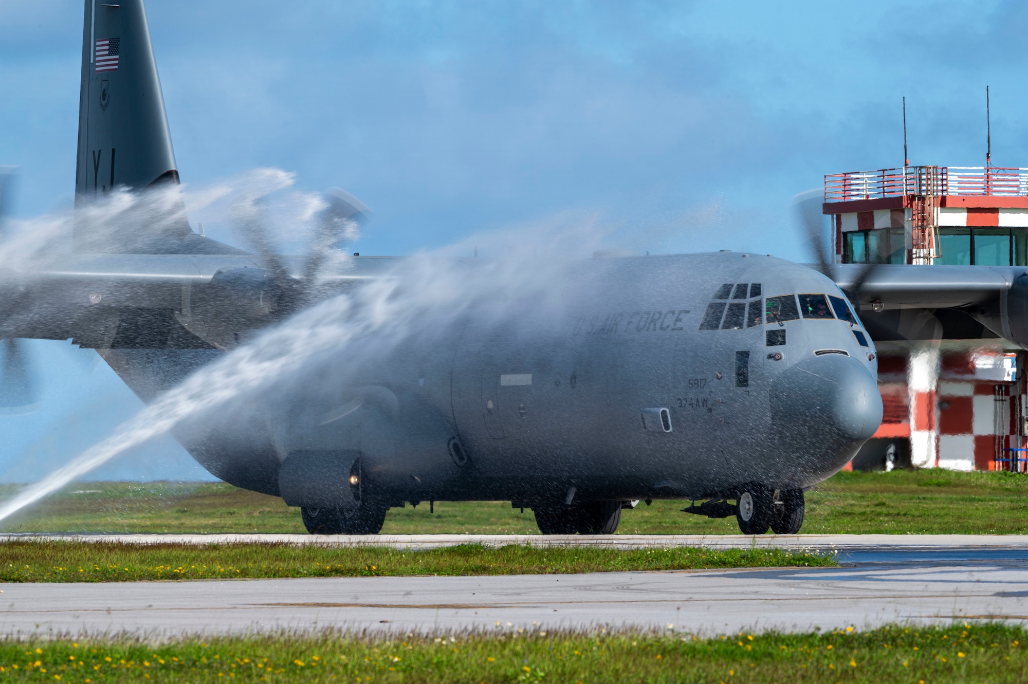 A C-130J aircraft is washed down.