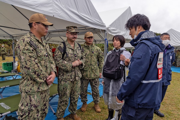JOGASHIMA PARK, Japan (Nov. 9, 2025) — U.S. Navy Hospital Corpsmen assigned to U.S. Navy Medicine Readiness and Training Command Yokosuka coordinate with Kanagawa Prefecture medical officials on triage procedures during Big Rescue Kanagawa 2025. The annual exercise is one of Kanagawa Prefecture’s largest disaster-response drills, involving U.S. Naval Hospital Yokosuka, Red Cross Yokosuka and Branch Health Clinic Atsugi personnel working alongside U.S. and Japanese agencies. (U.S. Navy photo by Daniel Taylor/USNMRTC Public Affairs)