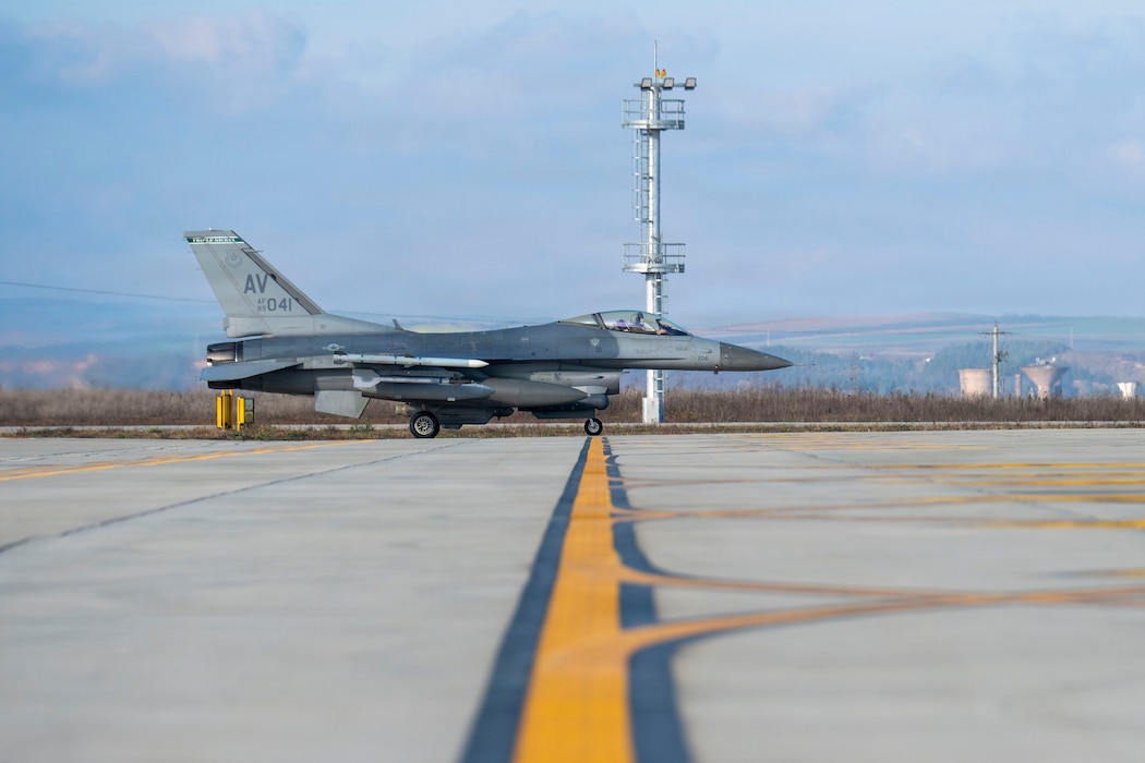 A U.S. Air Force F-16 Fighting Falcon from the 555th Fighter Generation Squadron at Aviano Air Base, Italy, taxis down the runway during routine Agile Combat Employment operations at Campia Turzii, Romania