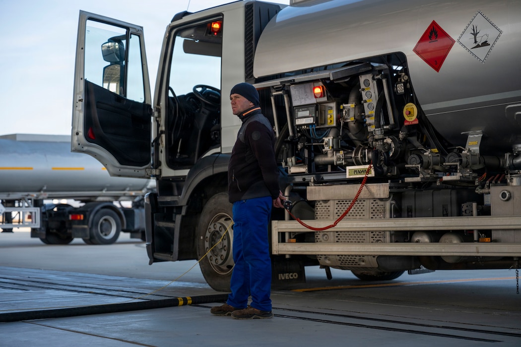 A Romanian Air Force member refuels a U.S. Air Force F-16 Fighting Falcon assigned to the 555th Fighter Squadron while conducting routine Agile Combat Employment operations at Campia Turzii, Romania