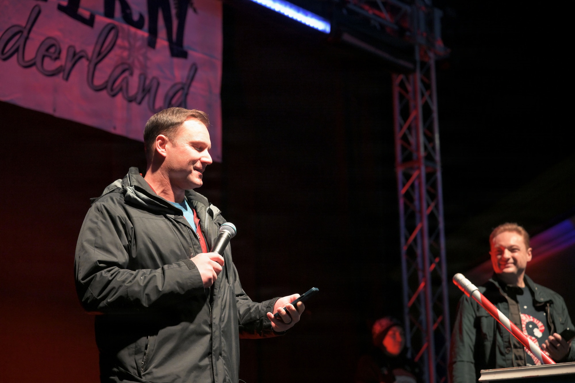 31FW leadership delivers opening remarks during a tree lighting ceremony.