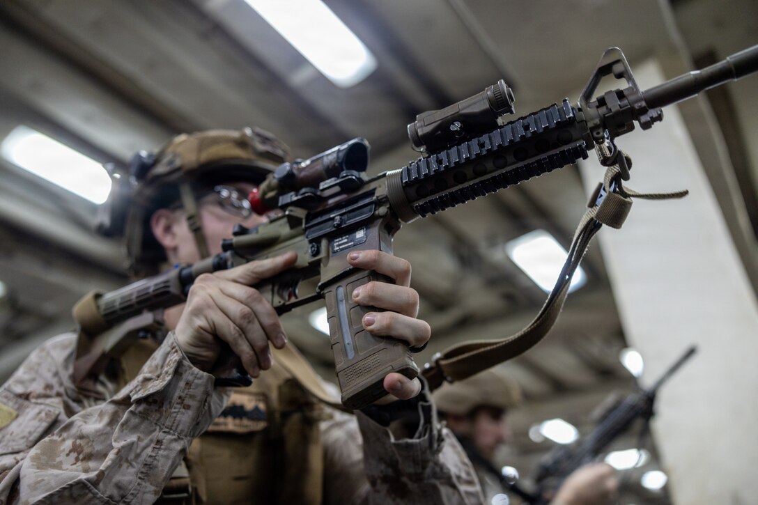A U.S. Marine with Light Armored Reconnaissance Company, Battalion Landing Team 3/6, 22nd Marine Expeditionary Unit (Special Operations Capable), conducts a speed reload drill during dry fire training, aboard San Antonio-class amphibious transport dock USS San Antonio (LPD 17), while underway in the Caribbean Sea, Dec. 3, 2025. U.S. military forces are deployed to the Caribbean in support of the U.S. Southern Command mission, Department of War-directed operations, and the president’s priorities to disrupt illicit drug trafficking and protect the homeland. (U.S. Marine Corps photo)
