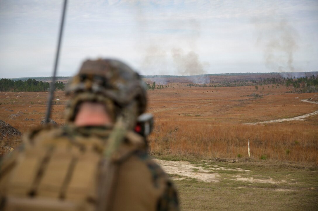 U.S. Marine Corps Sgt. Dylan Rodgers, a joint terminal attack controller with 3rd Force Reconnaissance, 4th Marine Division, Marine Forces Reserve, observes impacts of close-air support ordinance from a C-130J Super Hercules with Marine Aerial Refueler Transport Squadron (VMGR) 234 during a tactical air-control party (TACP) exercise in Hattiesburg, Mississippi, Dec. 3, 2025. TACP exercises prepare prospective joint terminal attack controllers and joint fires observers for formal schools. (U.S. Marine Corps photos by Lance Cpl. Payton Goodrich)