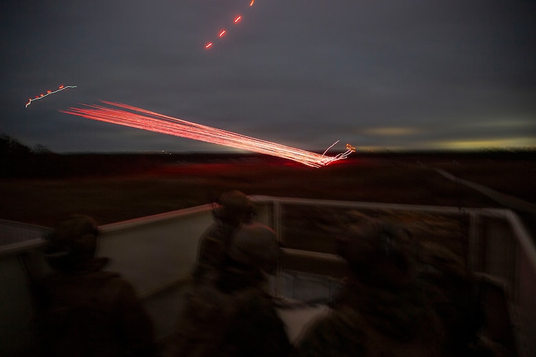 U.S. Marines with 3rd Naval Gunfire Liaison Company, Force Headquarters Group, Marine Forces Reserve, watch incoming close air support hit its target during a tactical air-control party (TACP) exercise at Rattlesnake Range, Hattiesburg, Mississippi, Dec. 2, 2025. TACP exercises prepare prospective joint terminal attack controllers and joint fires observers for formal schools. (U.S. Marine Corps photo by Lance Cpl. Payton Goodrich)