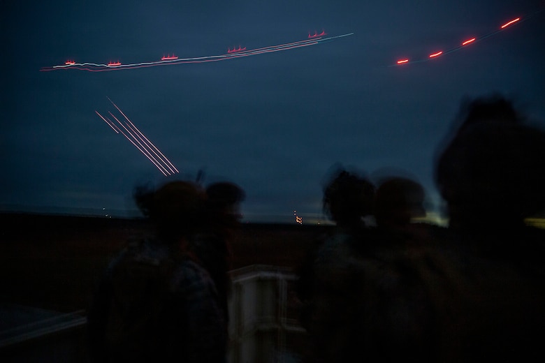 U.S. Marines with 3rd Naval Gunfire Liaison Company, Force Headquarters Group, Marine Forces Reserve, watch incoming close air support hit its target during a tactical air-control party (TACP) exercise at Rattlesnake Range, Hattiesburg, Mississippi, Dec. 2, 2025. TACP exercises prepare prospective joint terminal attack controllers and joint fires observers for formal schools. (U.S. Marine Corps photo by Lance Cpl. Payton Goodrich)