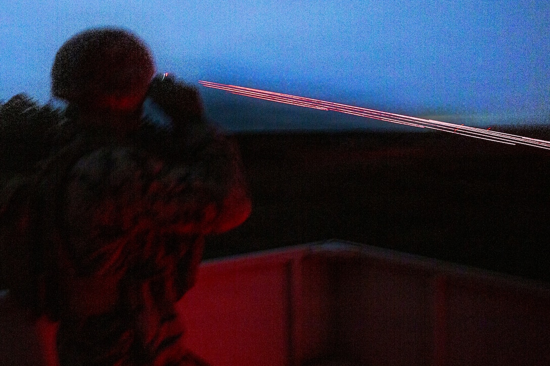 U.S. Marine Corps Sgt. Parker Jarrant, a joint terminal attack controller with 3rd Battalion, 14th Marines, 4th Marine Division, Marine Forces Reserve, watches as close air support hits its target during a tactical air-control party (TACP) exercise at Rattlesnake Range, Hattiesburg, Mississippi, Dec. 2, 2025. TACP exercises prepare prospective joint terminal attack controllers and joint fires observers for formal schools. (U.S. Marine Corps photo by Lance Cpl. Payton Goodrich)