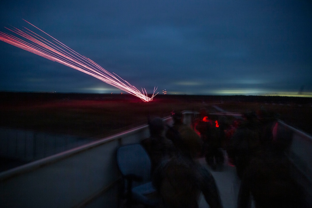 U.S. Marines with 3rd Naval Gunfire Liaison Company, Force Headquarters Group, Marine Forces Reserve, watch incoming close air support hit its target during a tactical air-control party (TACP) exercise at Rattlesnake Range, Hattiesburg, Mississippi, Dec. 2, 2025. TACP exercises prepare prospective joint terminal attack controllers and joint fires observers for formal schools. (U.S. Marine Corps photo by Lance Cpl. Payton Goodrich)