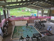 Lt. Lakoenavuli, Fiji Royal Military Forces, company commander, briefs the "culminating raid" during Exercise Cartwheel, Nov. 6, 2025.