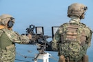 ARABIAN GULF (Dec. 8, 2025) U.S. Coast Guard Operations Specialist 1st Class Nathan Malinski fires .50 caliber machine gun during a live-fire training exercise aboard the Sentinel-class fast-response cutter USCGC Clarence Sutphin Jr. (WPC 1147) in the Arabian Gulf. Clarence Sutphin Jr. is forward deployed to the U.S. 5th Fleet area of operations to support maritime security and stability in the U.S. Central Command area of responsibility. (U.S. Navy photo by Mass Communication Specialist 2nd Class Lindsay Lair)
