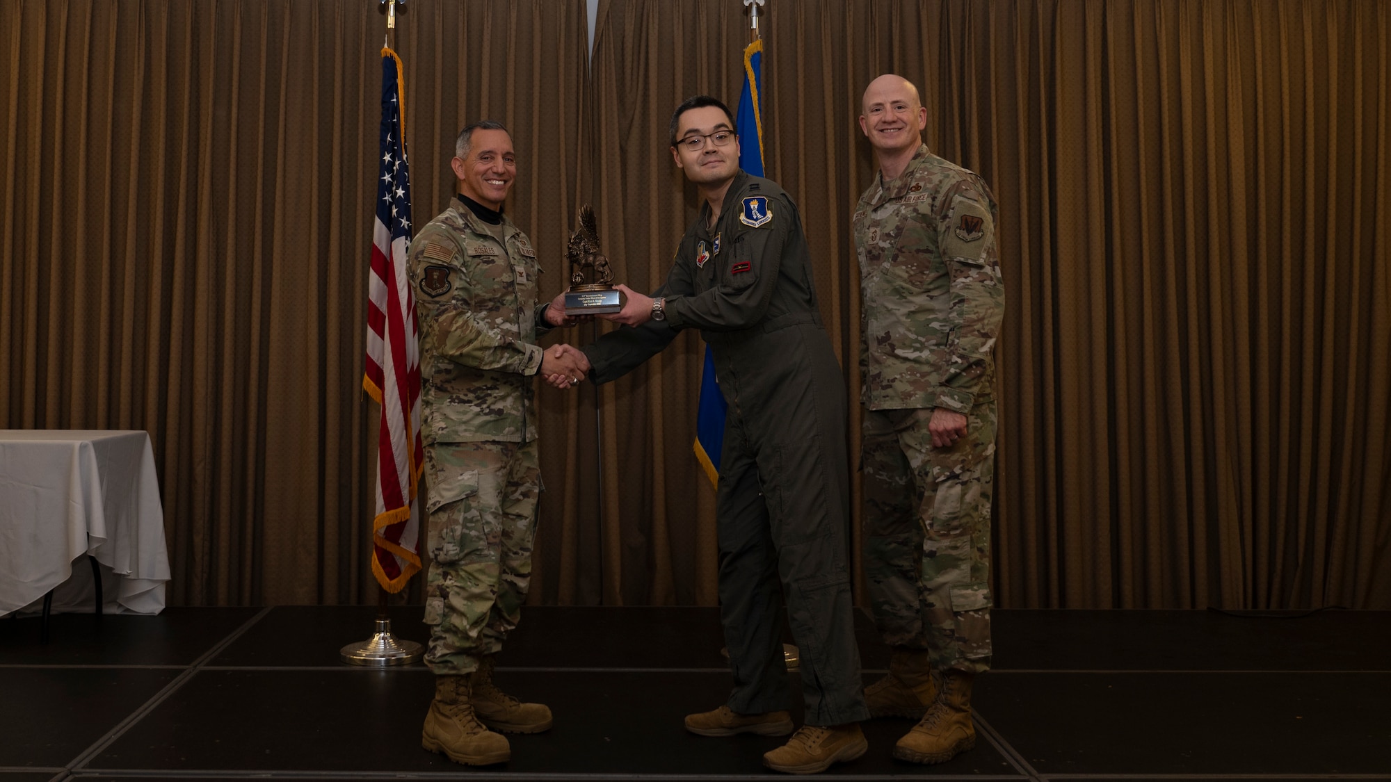 Person receives award during ceremony.