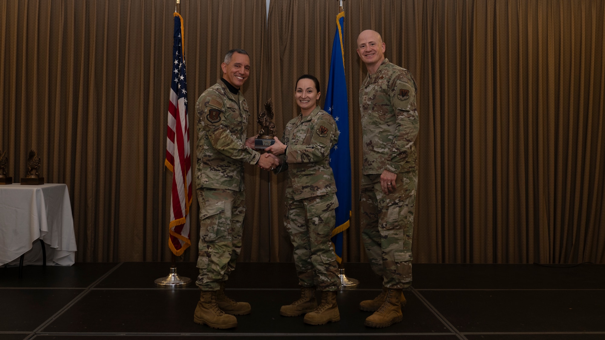 Person receives award during ceremony.