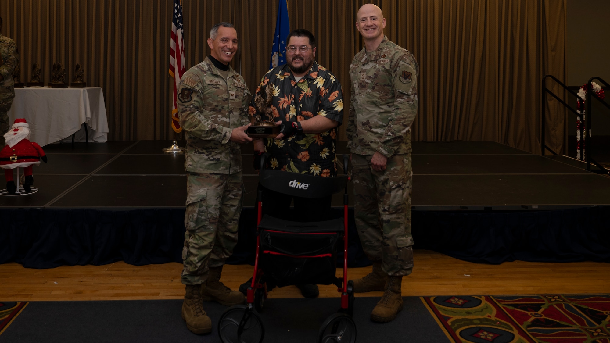 Person receives award during ceremony.