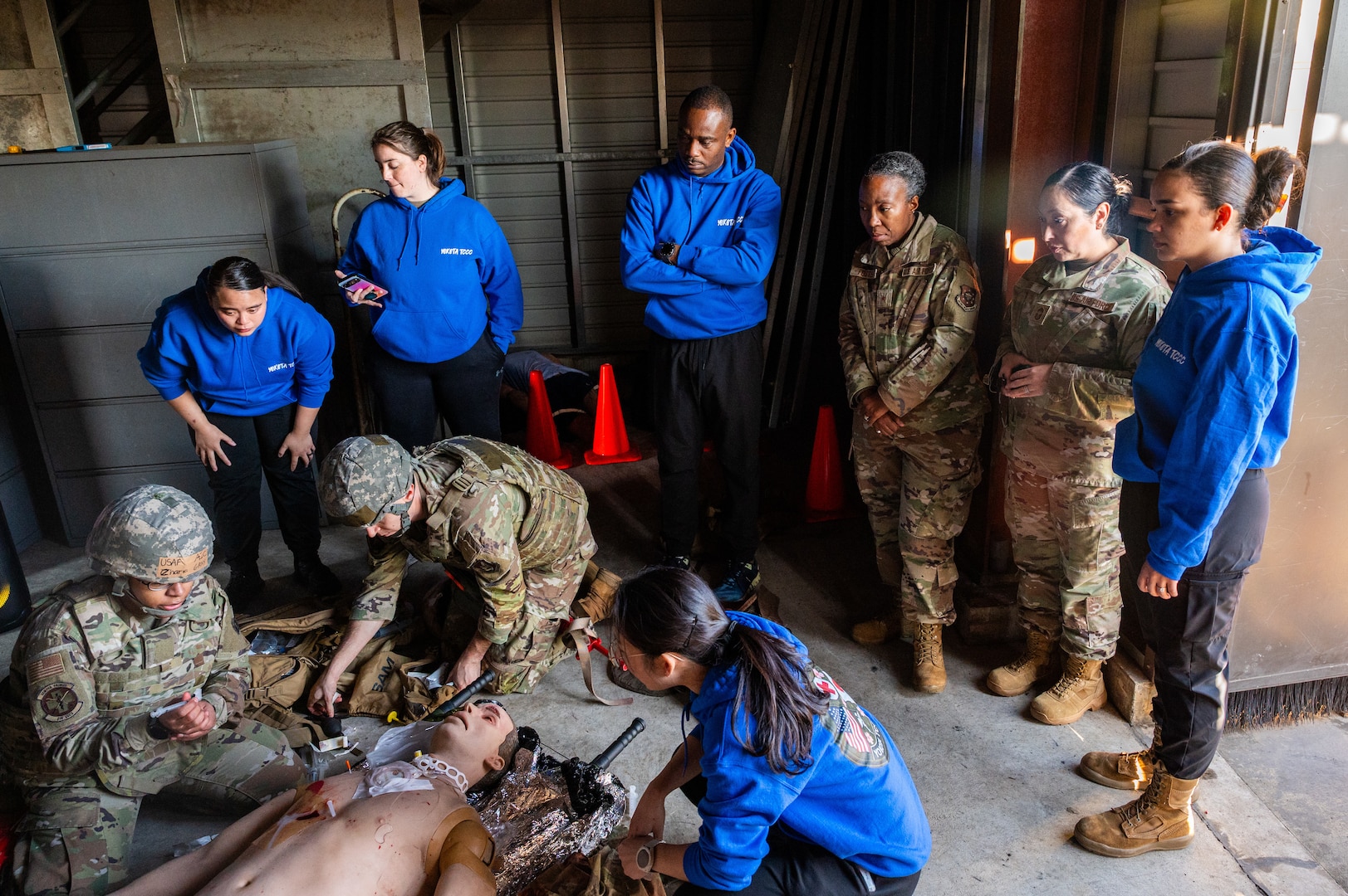 Airmen perform TCCC on simulated patients.