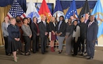Members of the 2025 graduating class of DLA Energy's Pathways to Career Excellence Program pose for a group photo after their graduation ceremony with Mr. George Atwood (center left) and other agency leaders at Fort Belvoir, Va., on October 22, 2025.