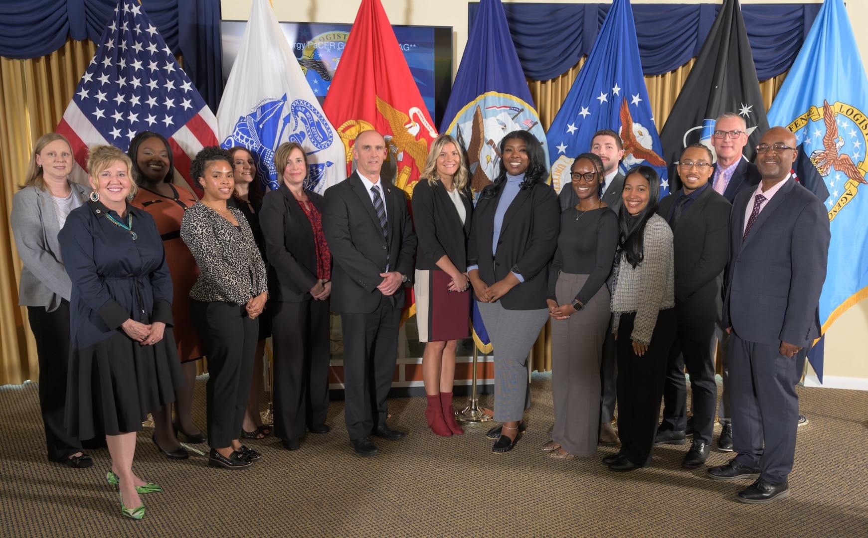Members of the 2025 graduating class of DLA Energy's Pathways to Career Excellence Program pose for a group photo after their graduation ceremony with Mr. George Atwood (center left) and other agency leaders at Fort Belvoir, Va., on October 22, 2025.
