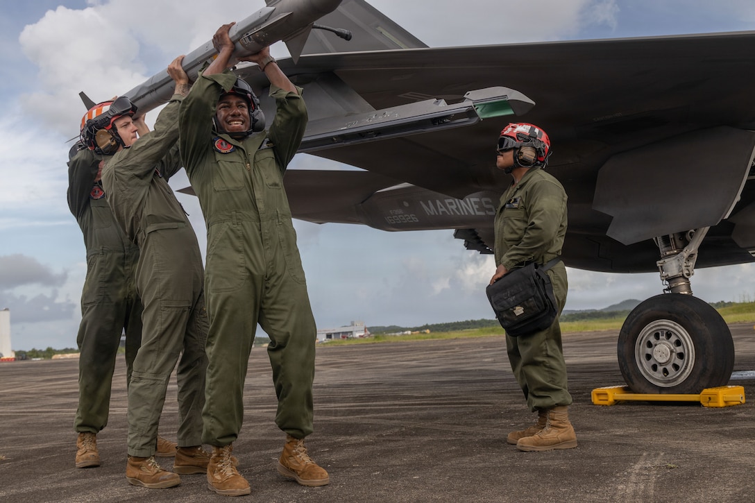 U.S. Marines with Marine Fighter Attack Squadron (VMFA) 225, U.S. Marine Corps Forces, South, lift an AIM-9 Sidewinder onto a U.S. Marine Corps F-35B Lightning II assigned to VMFA-225 during hot load training at Jose Aponte de la Torre Airport in Ceiba, Puerto Rico, Oct. 31, 2025. U.S. military forces are deployed to the Caribbean in support of the U.S. Southern Command mission, Department of War-directed operations, and the president’s priorities to disrupt illicit drug trafficking and protect the homeland. (U.S. Marine Corps photo)