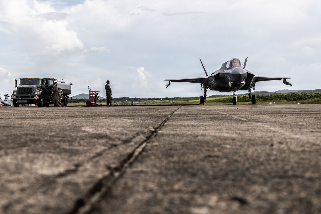 A U.S. Marine Corps F-35B Lightning II assigned to Marine Fighter Attack Squadron (VMFA) 225, U.S. Marine Corps Forces South, receives fuel from a tanker truck assigned to the 346th Air Expeditionary Wing at Jose Aponte de la Torre Airport in Ceiba, Puerto Rico, Oct. 28, 2025. U.S. military forces are deployed to the Caribbean in support of the U.S. Southern Command mission, Department of War-directed operations, and the president’s priorities to disrupt illicit drug trafficking and protect the homeland. (U.S. Marine Corps photo)