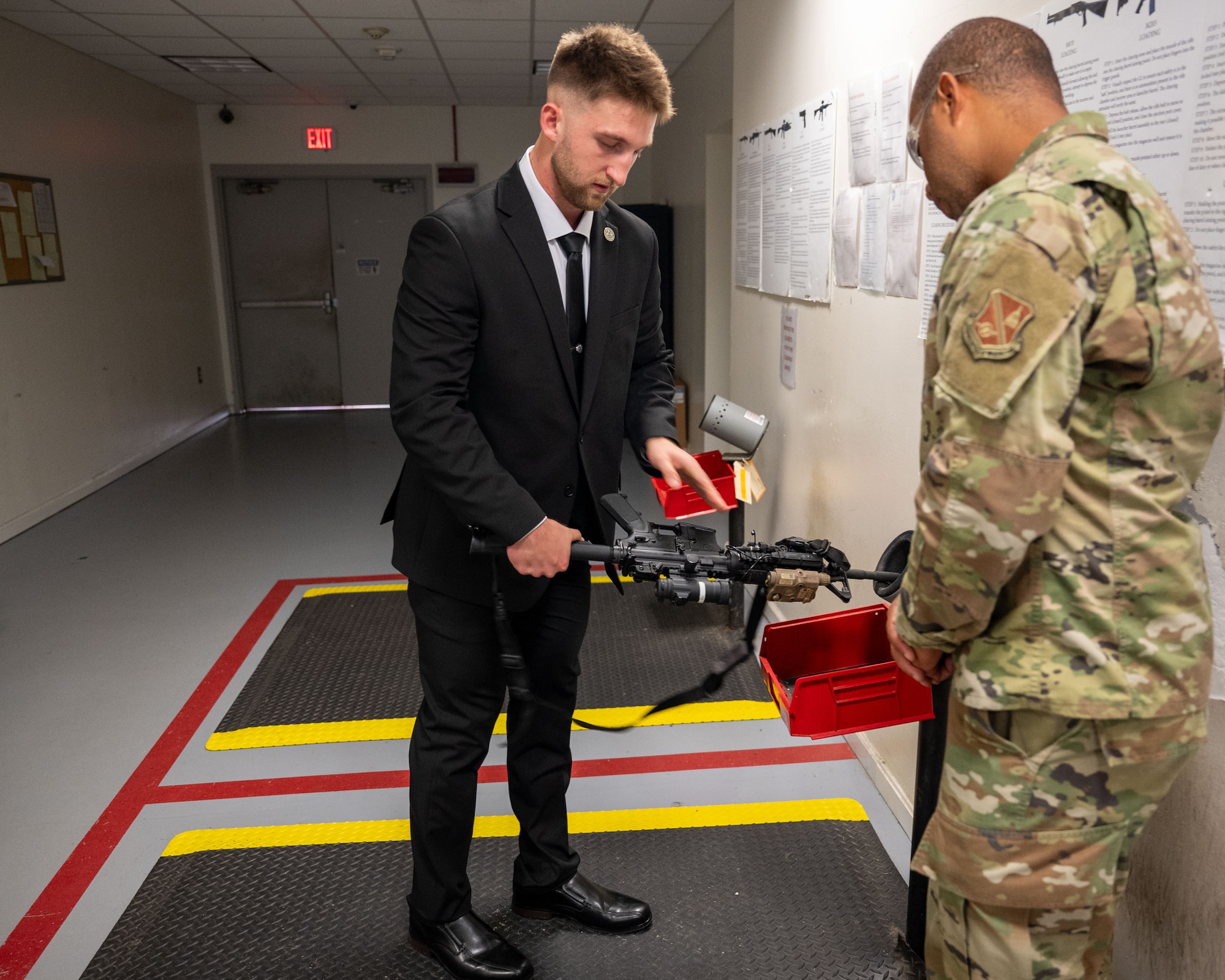 People inspect weapon