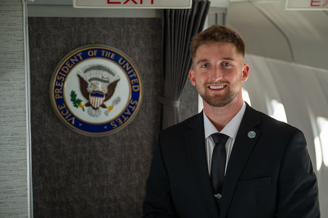 Person stands in front of Vice President seal