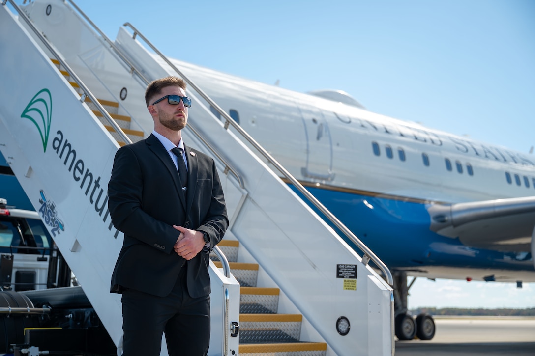 Person stands in front of aircraft stairs